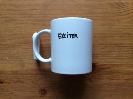 09 - Exciter 2001 U.K. Promo Mug (1).JPG